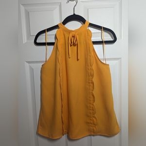 Sleeveless yellow blouse